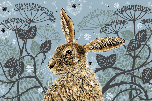 This tea towel design features a hare portrait with one floppy ear, around the hare are stylised brambles, leaves, cow parsley and dandelion puffs, background colour is a grey blue.