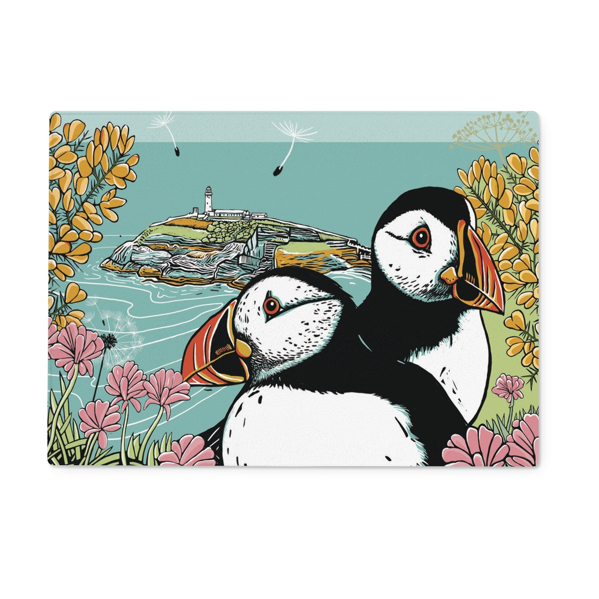 This Fox and Boo design features two puffins side by side on a clifftop, surrounded by sea thrift and gorse, backdrop is a small island with a lighthouse.
