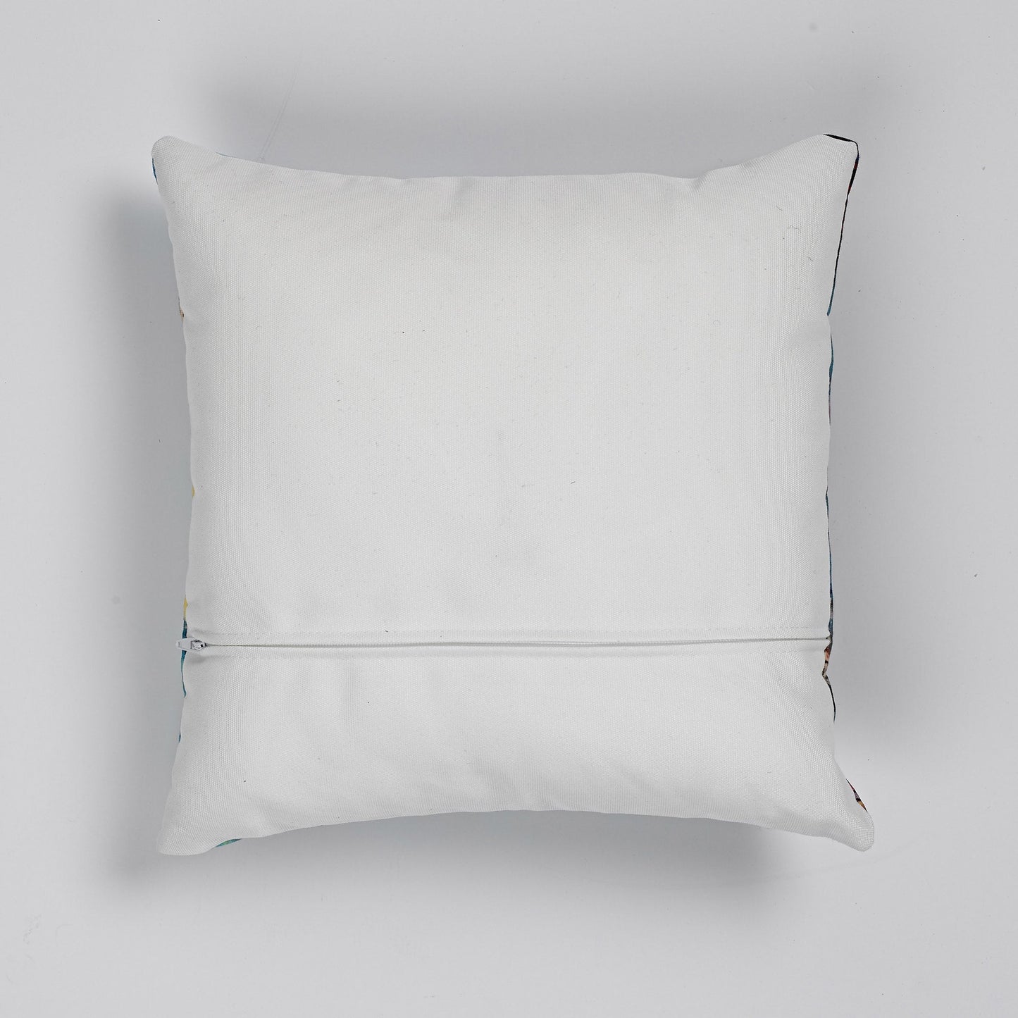Reverse of faux linen cushion, which is ivory, with zipper for cover removal.