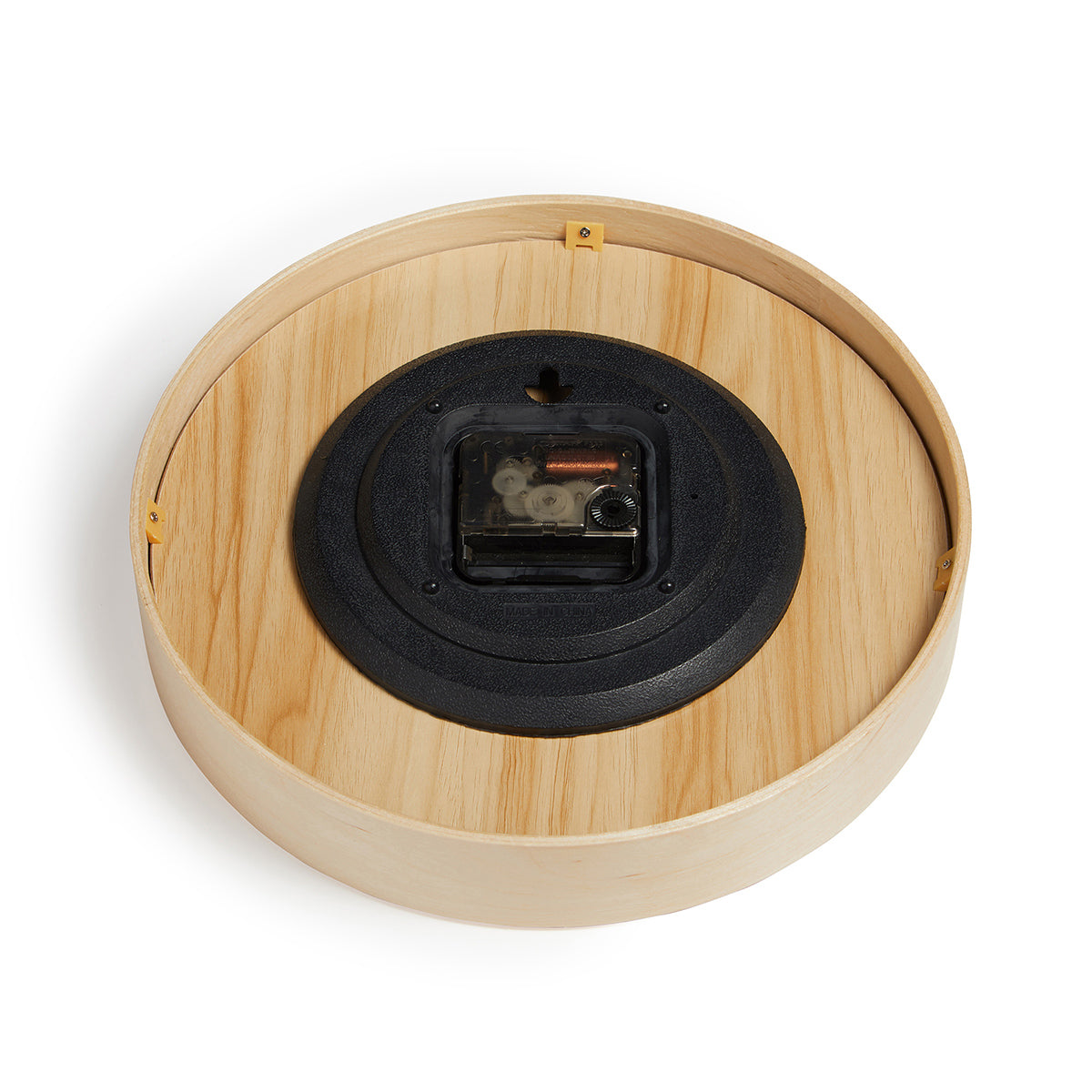 Close up of rear of natural bamboo wall clock 