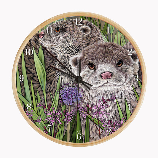 Otter Wall Clock featuring two illustrated otters among rushes and ragged robin flowers on a bamboo frame.